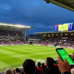 Live World Cup - Cabong TV betting predictions with match odds and expert picks displayed in a vibrant stadium atmosphere.